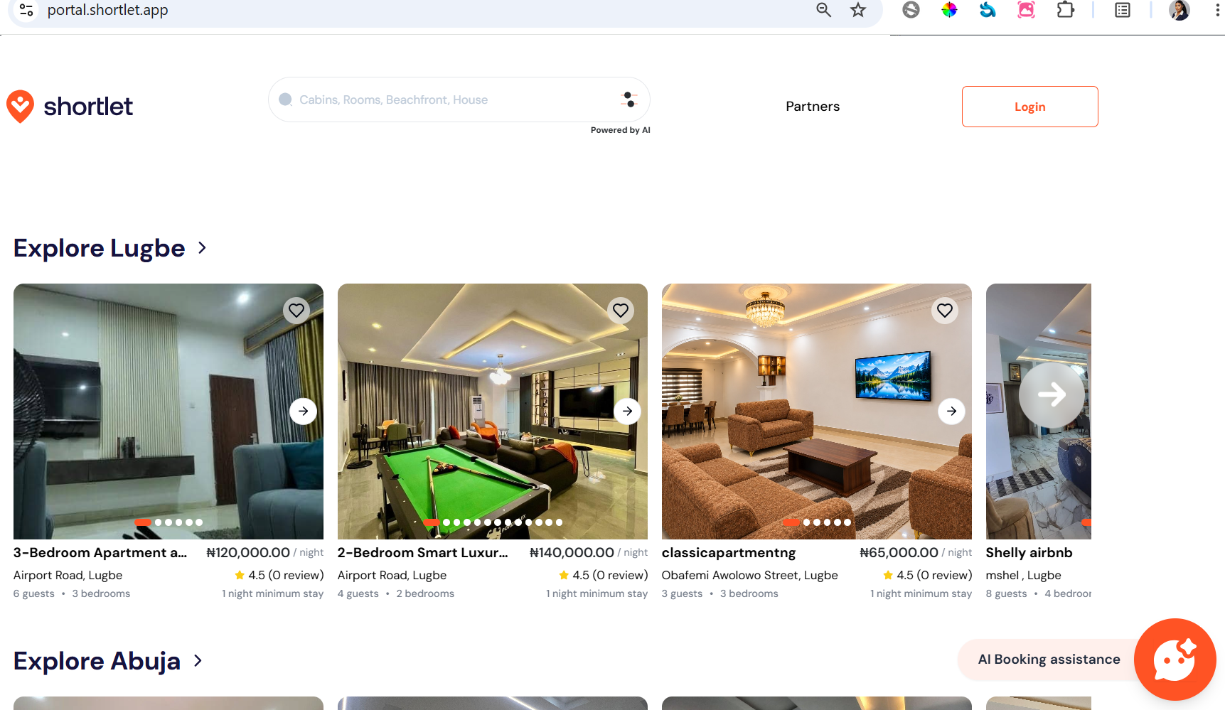 Shortlet’s live property marketplace, with property listings and the AI Booking assistance launcher.